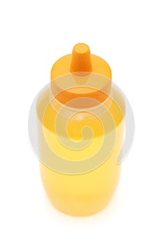 Plastic bottle of honey
