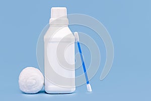 Plastic bottle for hydrogen peroxide, blue background, medicine concept, with copy space