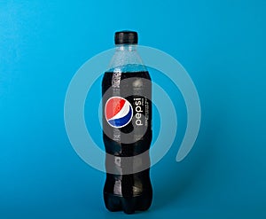 Plastic bottle of Pepsi Cola MAX 0.5 liters on a blue background. Zero calories Pepsi soft drink bottle isolated on blue