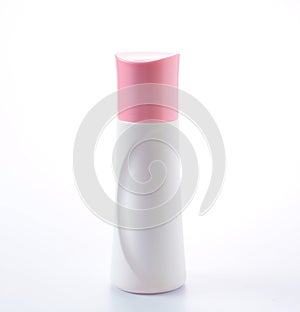 Plastic bottle pink cap on white background