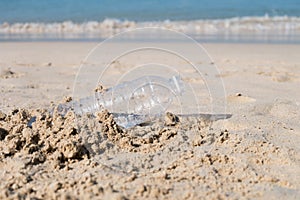 Plastic bottle on sand beach