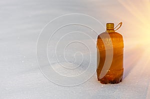 Plastic bottle in the snow
