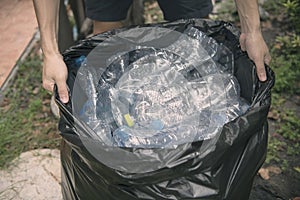 Plastic bottle in trash for recycle and reduce ecology