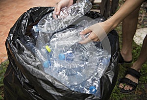 Plastic bottle in trash for recycle and reduce ecology
