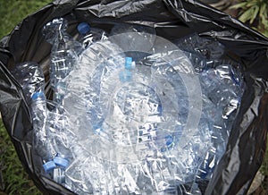 Plastic bottle in trash for recycle and reduce ecology