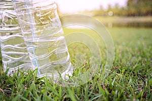 Plastic bottle waste on the grass in the park was left unattended. Plastic waste causes residual pollution in the environment