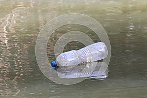 Plastic Bottle Waste On the water surface dirty, Rotten water, Bottle Waste