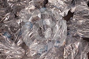 Plastic bottles background. Empty bottles on black surface