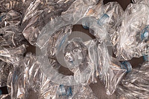 Plastic bottles background. Empty bottles on black surface