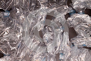 Plastic bottles background. Empty bottles on black surface