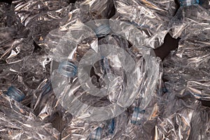 Plastic bottles background. Empty bottles on black surface photo