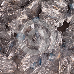 Plastic bottles background. Empty bottles on black surface