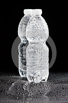 Plastic bottles on a black background