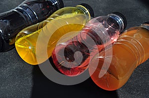 Plastic bottles with colored liquid