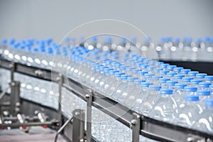 Plastic bottles on conveyor belt photo