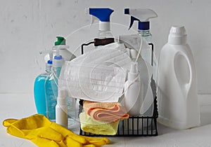 Plastic bottles with detergents and disinfectants on a light background for cleaning and disinfecting at home.Use of protective