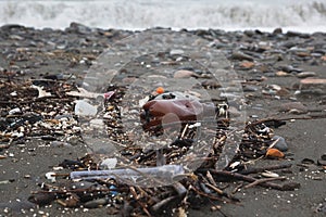 Plastic bottles and garbage on sea beach