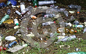 Plastic bottles and other rubbish on the polluted river