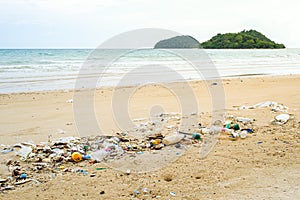 Plastic bottles and other trash on sea beach