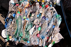 Plastic bottles on pile, ready to get recycled. Recycling of old plastic bottles. Pile of packed and recycling.