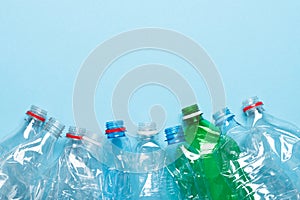 Plastic bottles recycle border on blue background