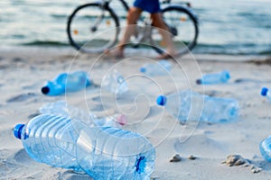 Plastic bottles on sea beach. Environmental pollution by plastic waste