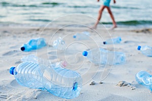 Plastic bottles on sea beach. Environmental pollution by plastic waste