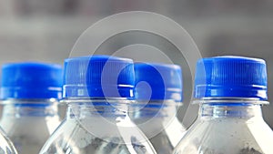 plastic bottles of soft drink on table