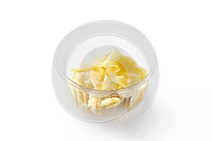 Plastic bowl of pickled ginger, traditional Japanese sushi accompaniment photo