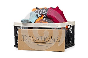 Plastic box with clothing donations and cardboard sign