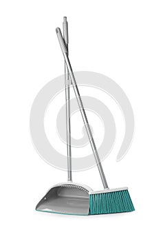 Plastic broom and dustpan on white background