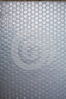 Plastic Bubble Cushioning Wrap surface texture on white background, Close up shot, Transparent wrapping concept