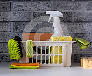 Plastic bucket with cleaning supplies