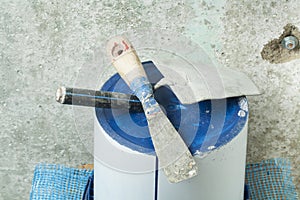 Plastic bucket with construction tools. Renovation concept.
