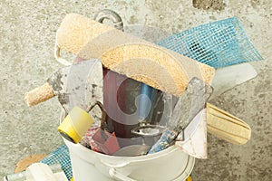 Plastic bucket with construction tools. Renovation concept.