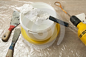 Plastic bucket with construction tools. Renovation concept.