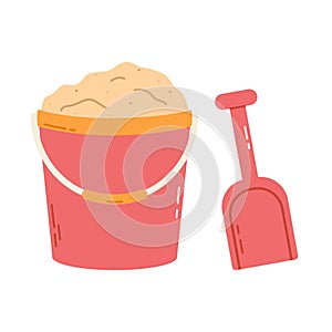 Plastic bucket filled with sand with shovel