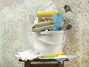 Plastic bucket with construction tools. Renovation concept.
