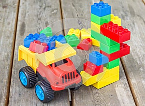 Plastic building blocks and toy truck