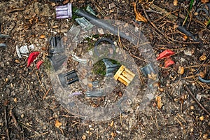 Plastic buried in the ground in the woods