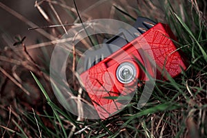 Plastic camera toy in grass background wallpaper