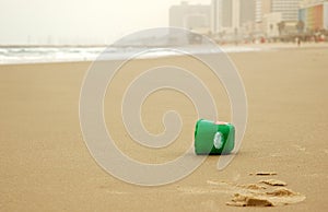 Plastic can on empty beach