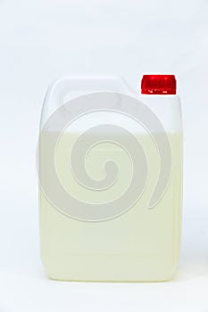 Plastic canister with liquid on white background