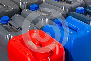 Plastic canisters different color in the warehouse