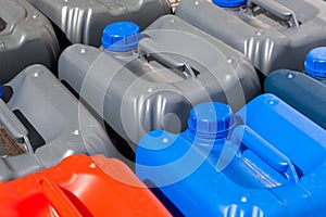Plastic canisters different color in the warehouse