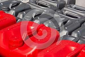 Plastic canisters red and blue color in the warehouse