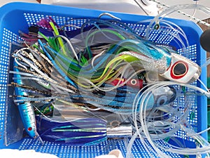 Plastic case full of attractive lures for a big game fishing trip. Colored lures for a physical activity.