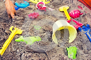 Plastic children toys in sandpit