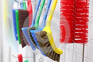 plastic cleaning brushes in supermarket hanger