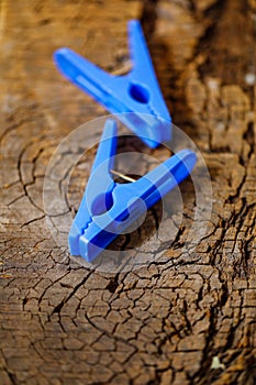 Plastic cloth clip on wooden background